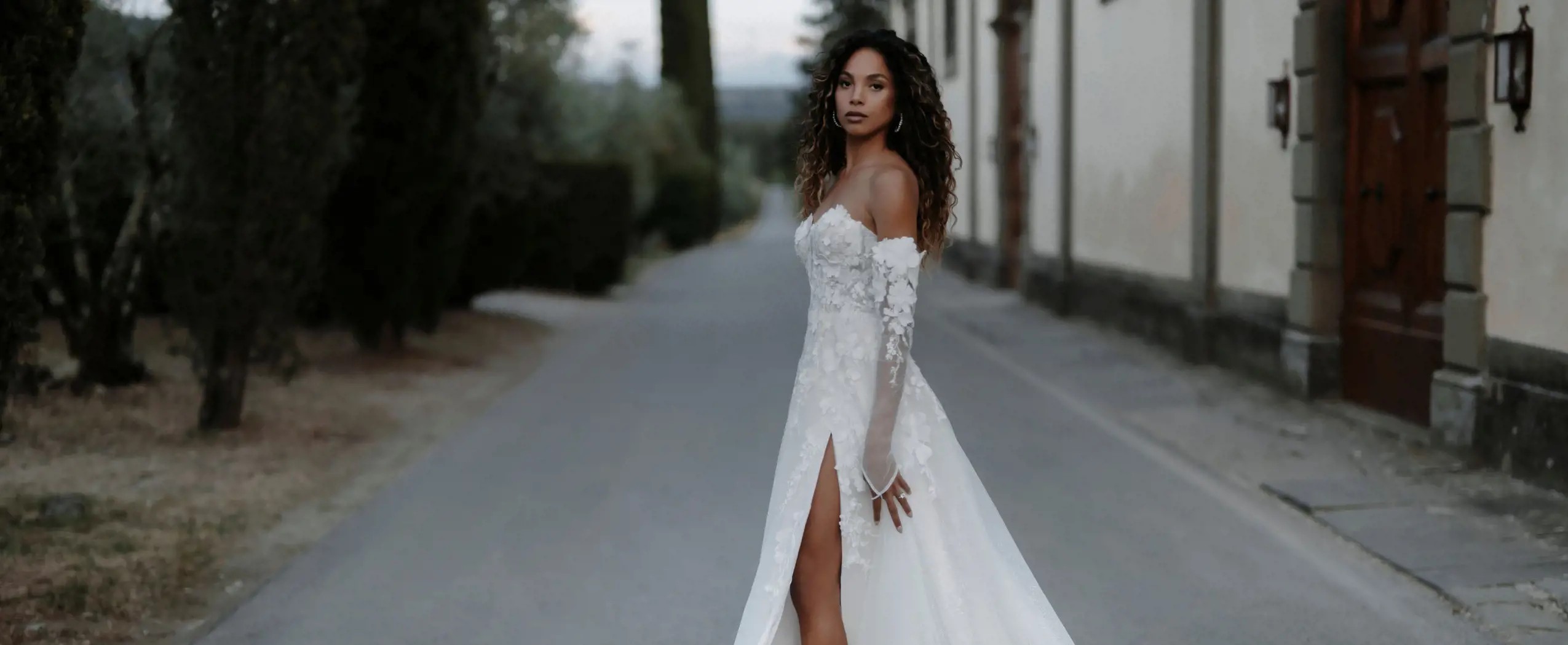 Photo of model wearing a Abella collection gown