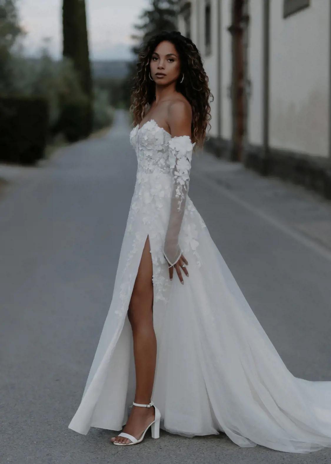 Photo of model wearing a Abella collection gown
