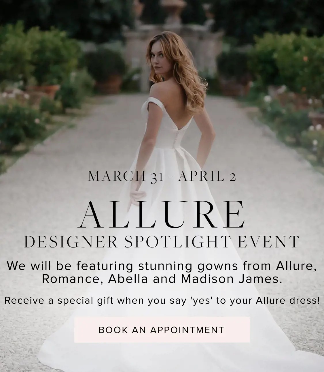 Allure trunk show at Bliss Bridal. Model wearing bridal dress facing back.